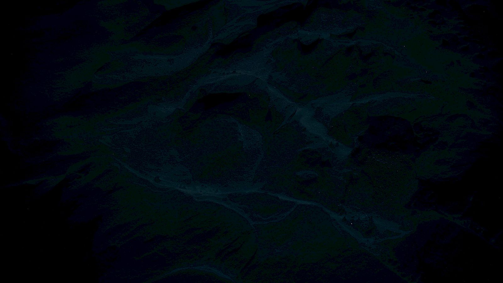 A dark, underwater scene with rippling waves and deep blue shadows, like the ocean floor viewed from above at night.